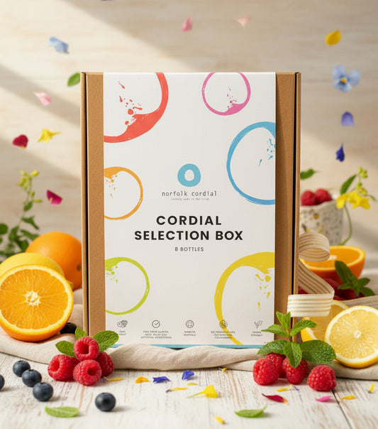Cordial selection box with colorful design on a white background