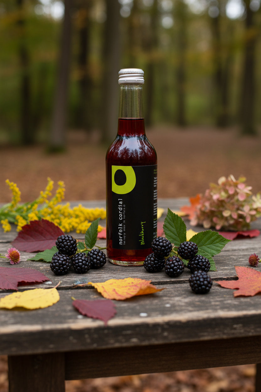 Bottle of Norfolk Cordial blackberry syrup on a white background