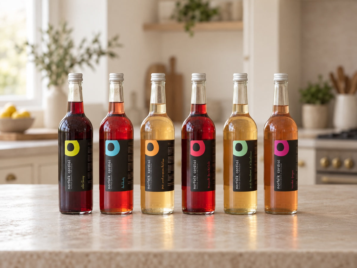 Norfolk Cordial 750ml bottle range displayed together in a bright kitchen