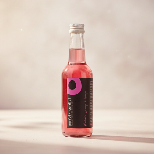 Norfolk Cordial Rhubarb, Orange & Ginger 250ml bottle on a warm neutral background