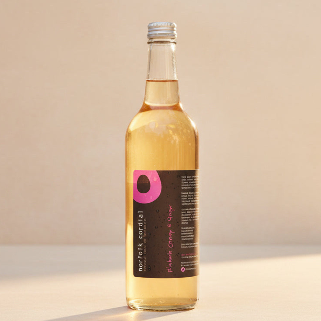 Norfolk Cordial Rhubarb, Orange & Ginger 750ml bottle on a warm neutral background