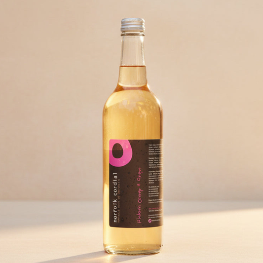 Norfolk Cordial Rhubarb, Orange & Ginger 750ml bottle on a warm neutral background