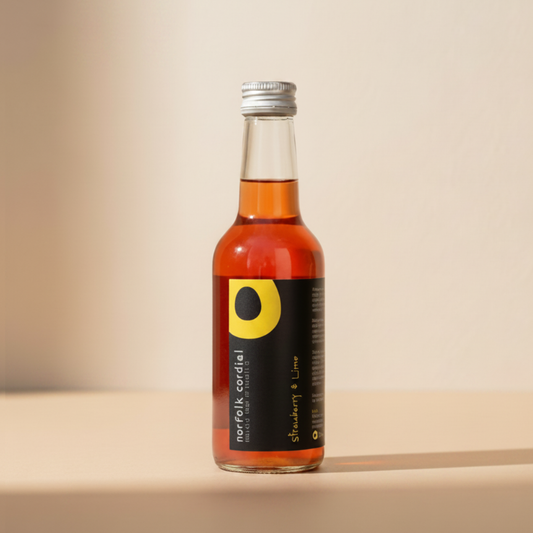 Norfolk Cordial Strawberry & Lime 250ml bottle on a warm neutral background