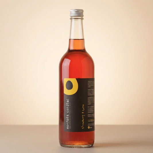 Norfolk Cordial Strawberry & Lime 750ml bottle on a warm neutral background