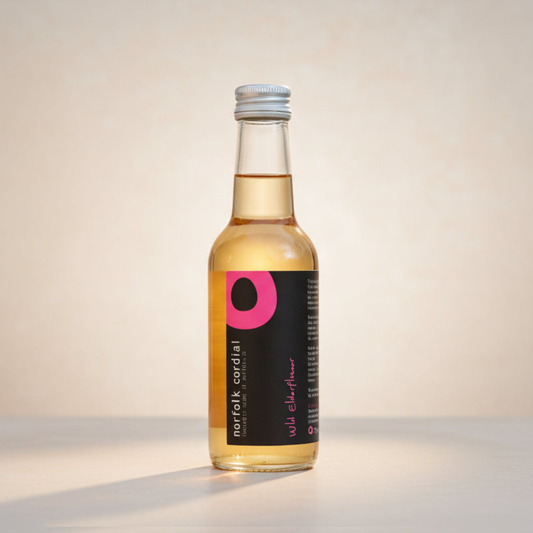 Norfolk Cordial Wild Elderflower 250ml bottle on a warm neutral background