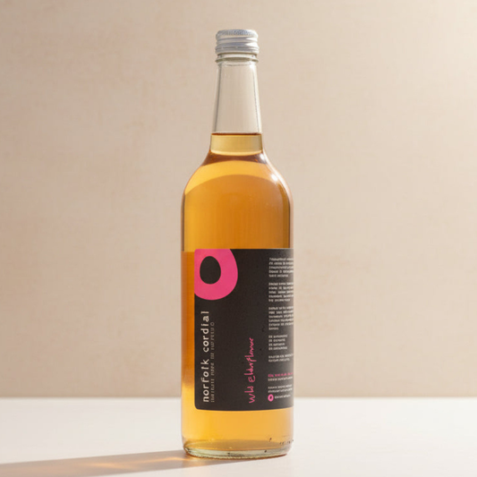 Norfolk Cordial Wild Elderflower 750ml bottle on a warm neutral background